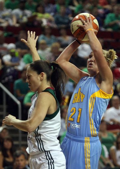 Former Gonzaga standout Courtney Vandersloot attempts a shot over Seattle’s Sue Bird during the Storm’s 81-70 win over Chicago. (Associated Press)