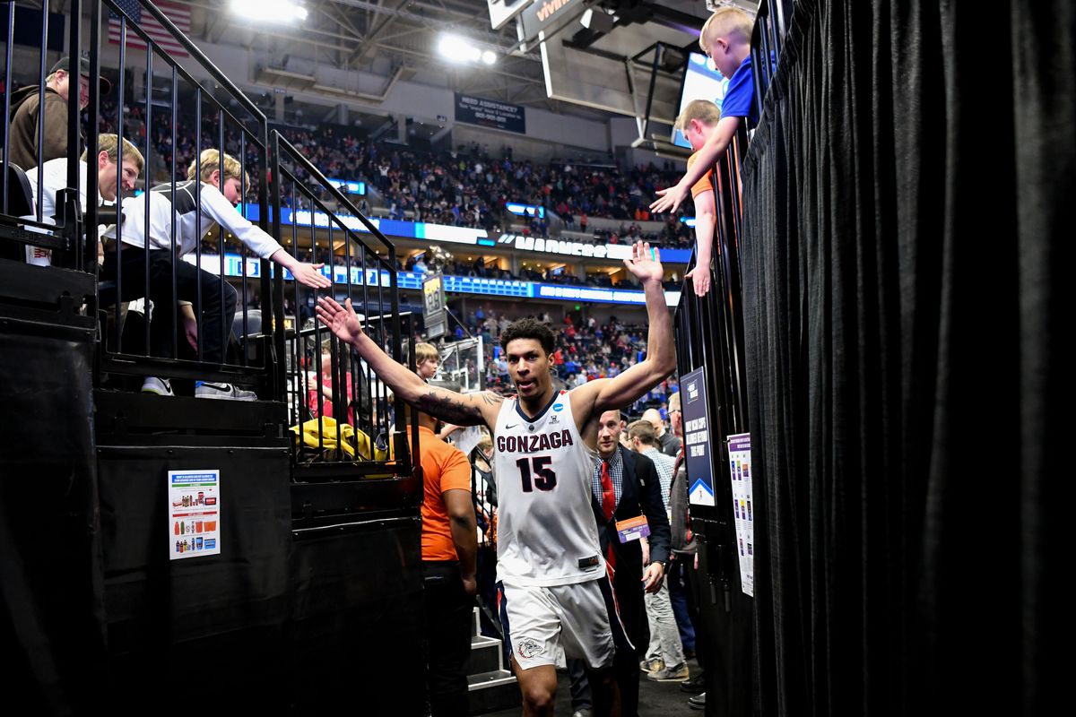 Gonzaga Bulldogs forward Brandon Clarke (15) high fives fans as he heads to the locker room after the second half of a second round mens basketball game in the NCAA Tournament against the Baylor Bears on Saturday, March 23, 2019, at Vivint Smart Home Arena in Salt Lake City, Utah. Gonzaga won the game 83-71. (Tyler Tjomsland / The Spokesman-Review)