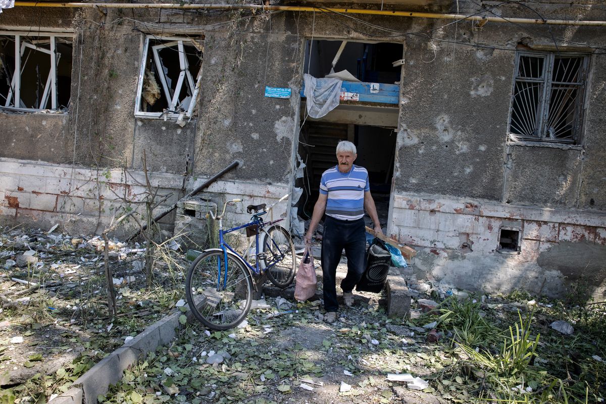 A man salvages what he can from the wreckage of an apartment building in Toretsk, in the Donetsk region of eastern Ukraine, on Tuesday, June 6, 2023. The city was struck overnight in an attack by Russian forces.    (Tyler Hicks/The New York Times)