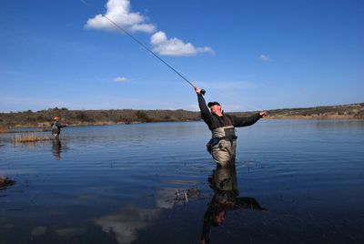 Fly fishing guide George Cook double-hauls a cast on a private trophy trout fishing lake he helps manage at Isaak’s Ranch near Coulee City. (Rich Landers / The Spokesman-Review)