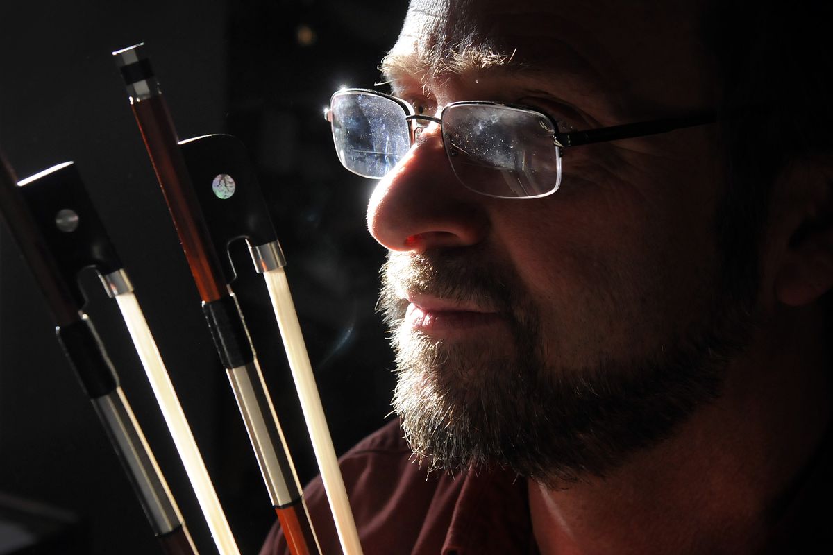 Morgan Andersen makes violin bows in his Rosalia home. His bows are valued at more than $4,800 each. (Dan Pelle)