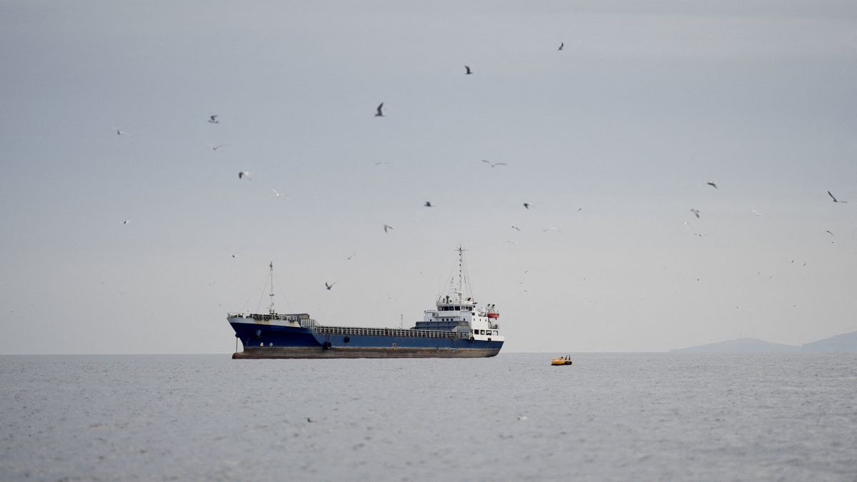 A vessel sits on Sunday at the Strait of Hormuz, off the coast of Oman’s Musandam province.  (Reuters)