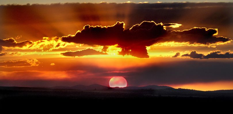 Wildfires in central Washington make for a spectacular sunset over Spokane, Wash. on Friday evening, Aug. 1, 2008, as the sun tries to burn through the smoke plume of thousands of acres that have burned over the past few days. (Christopher Anderson / The Spokesman-Review)