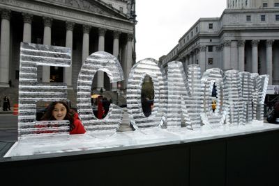 Carolina Soto, 9, from Princeton, N.J., pokes her head through an ice sculpture titled “Main Street Meltdown” in New York last week. The sculpture is the work of artists Nora Liganno and Marshall Reese, and is the fourth in a series addressing political issues. (File Associated Press / The Spokesman-Review)