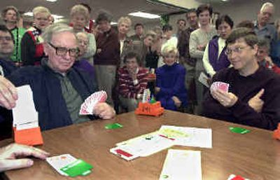 
Billionaires Bill Gates and Warren Buffett, play a hand of bridge during the Omaha bridge tournament in 2000, in Omaha, Neb. Their friendship goes back to 1991. 
 (Associated Press / The Spokesman-Review)