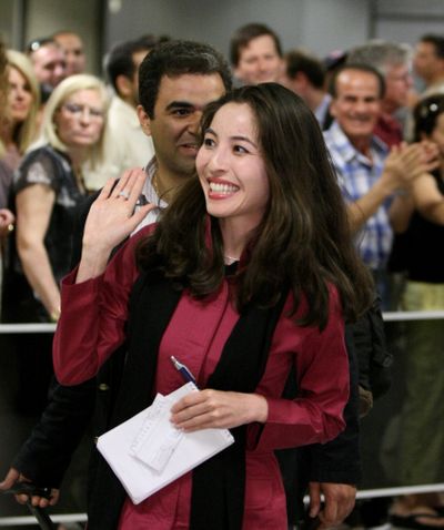 Journalist Roxana Saberi smiles as she arrives at Washington Dulles International Airport on Friday.  (Associated Press / The Spokesman-Review)