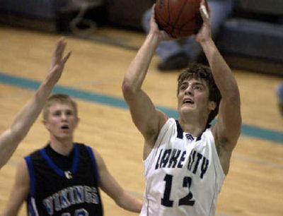 
Lake City's Brad Bemis takes a shot during Thursday night's 70-67 double-overtime win over Coeur d'Alene. 
 (Tom Davenport/ / The Spokesman-Review)