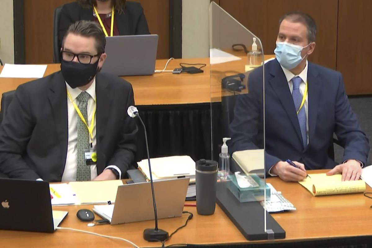 In this image from video, defense attorney Eric Nelson, left, and defendant former Minneapolis police Officer Derek Chauvin, right, listen as Hennepin County Judge Peter Cahill discusses motions before the court Monday, April 5, 2021, in the trial of Chauvin at the Hennepin County Courthouse in Minneapolis. Chauvin is charged in the May 25, 2020, death of George Floyd.  (POOL)