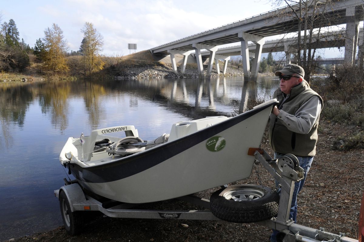 Spokane fly fisherman Stann Grater launches his drift boat at an unofficial site just downstream of Interstate 90 at Stateline. River access on the 111-mile Spokane River corridor is limited and Grater and other fly-fishermen advocate more access points. The proposed realignment of the Centennial Trail at Gateway Park will still allow access to the informal boat launch. (J. BART RAYNIAK)