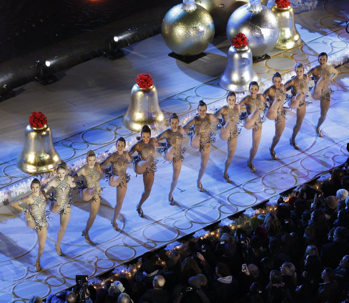 The Radio City Music Hall Rockettes perform before the Rockefeller Center Christmas Tree is lit during the 80th annual tree lighting ceremony at Rockefeller Center in New York, Wednesday, Nov. 28, 2012. (Kathy Willens / Associated Press)