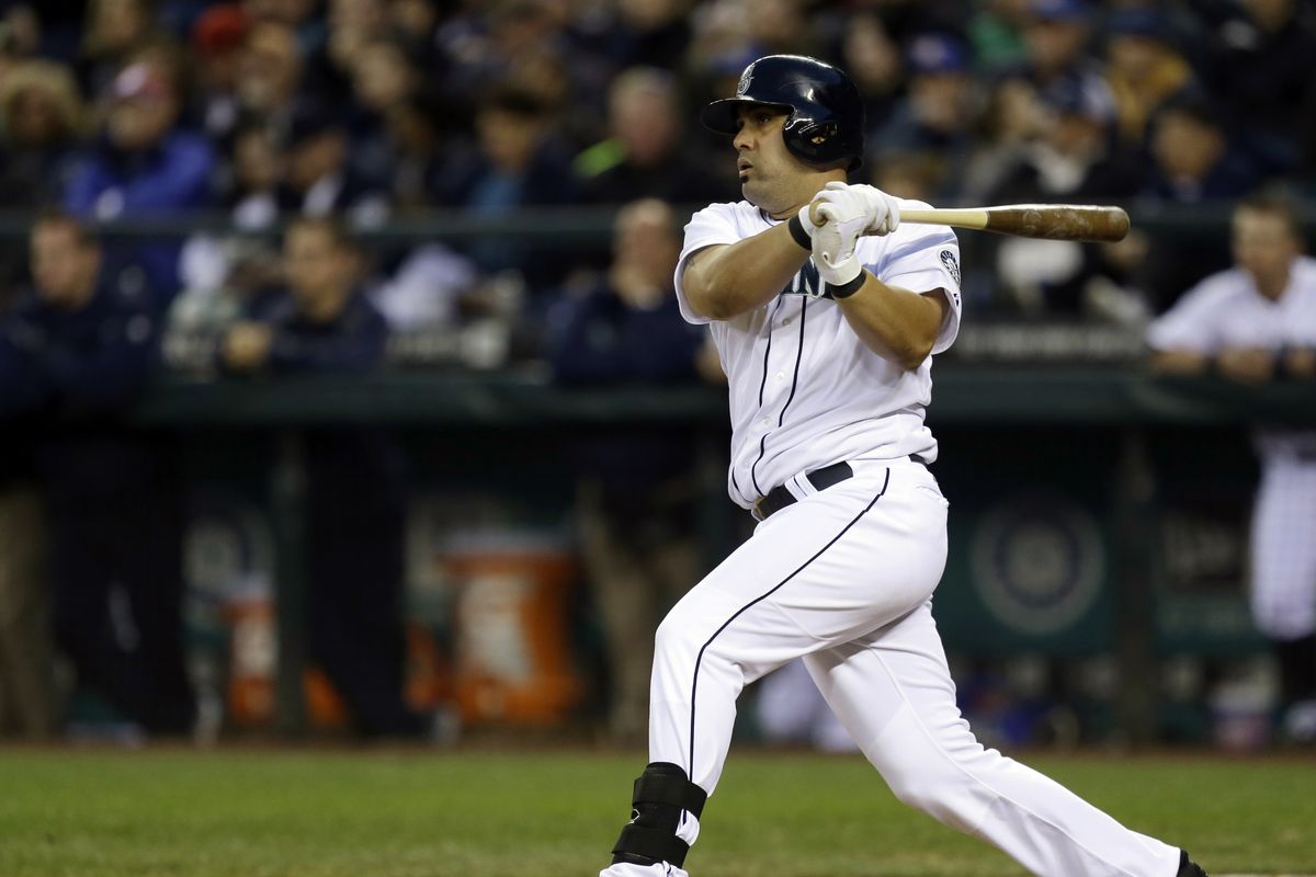 Seattle’s Kendrys Morales drills a pinch-hit RBI single in the seventh inning to key Saturday’s win. (Associated Press)