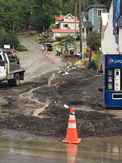 Workers examine the apparent site of a water main break in Harrison, Idaho, in this August 2019 photo. The town’s public works department issued an order not to drink the water in the shoreline resort town of roughly 200 residents beginning Friday, Aug. 23, 2019. (Tom Neville / Courtesy)