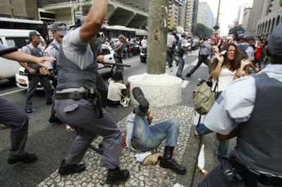 
Policemen fight demonstrators  ahead of President Bush's visit in Sao Paulo, Brazil, on Thursday. 
 (Associated Press / The Spokesman-Review)