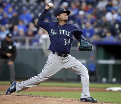 Seattle starting pitcher Felix Hernandez delivers to a Kansas City Royals batter during the first inning Tuesday  in Kansas City, Missouri. (Orlin Wagner / AP)