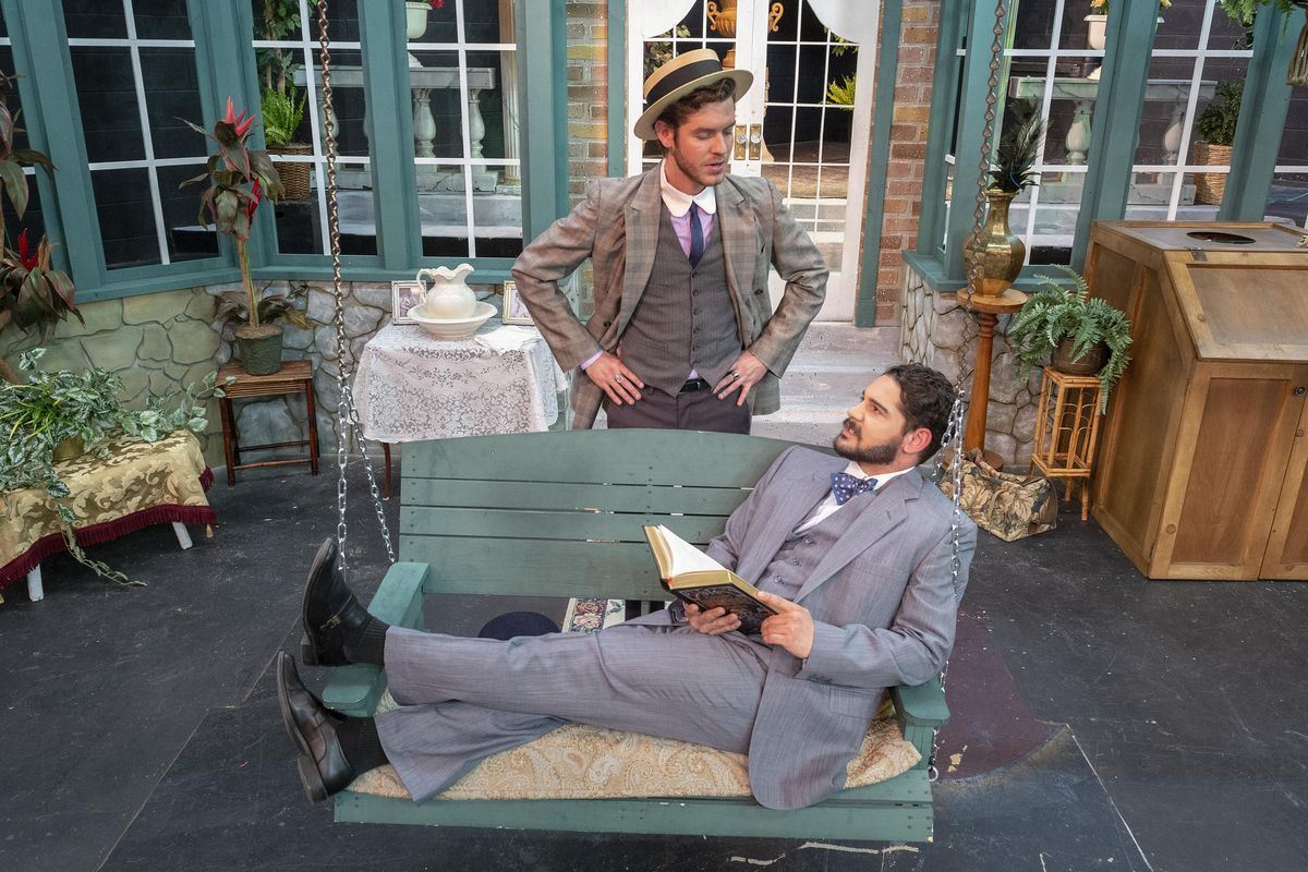 Actor Joshua Baig (on swing), playing Johnny Tarelton, and Dennis Burgess, playing Bunny Summerhays, perform a scene from Spokane Civic Studio Theatre’s production of “Misalliance,” which runs from Friday through May 20. (Colin Mulvany / The Spokesman-Review)