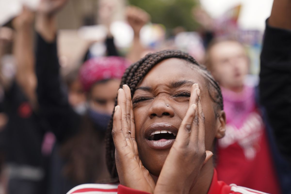 A woman speaks during a protest Wednesday in Louisville, Ky. following the indictment decision in Breonna Taylor’s case. (John Minchillo)