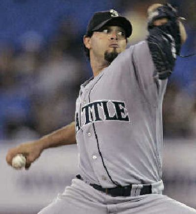 
Seattle's Joel Piñeiro shook a rocky first inning only to give up a costly home run in the eighth. 
 (Associated Press / The Spokesman-Review)