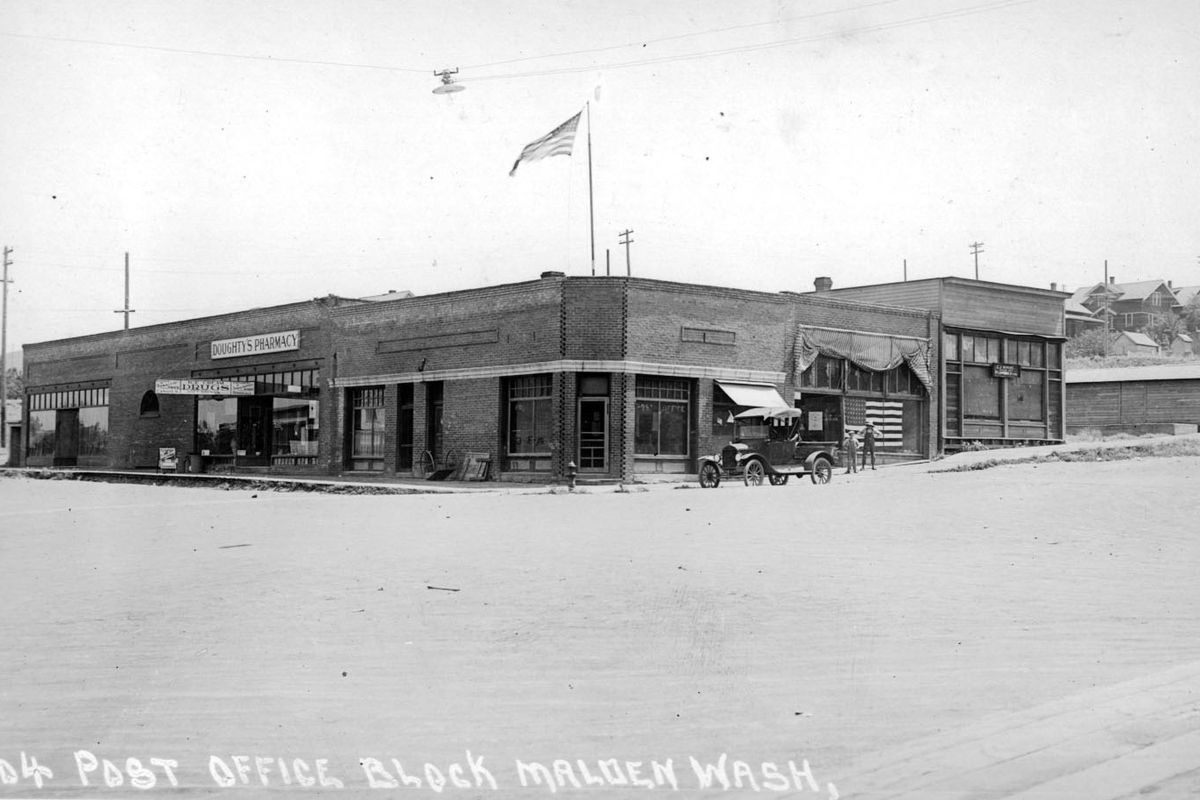 Malden, located between Pine City and Rosalia in Whitman County, had as many as 2,500 residents in the early 1900s. In 1928 this downtown building housed the Post Office, a pharmacy and other businesses. Malden is much smaller today with a population of 200.  (PHOTO ARCHIVE)