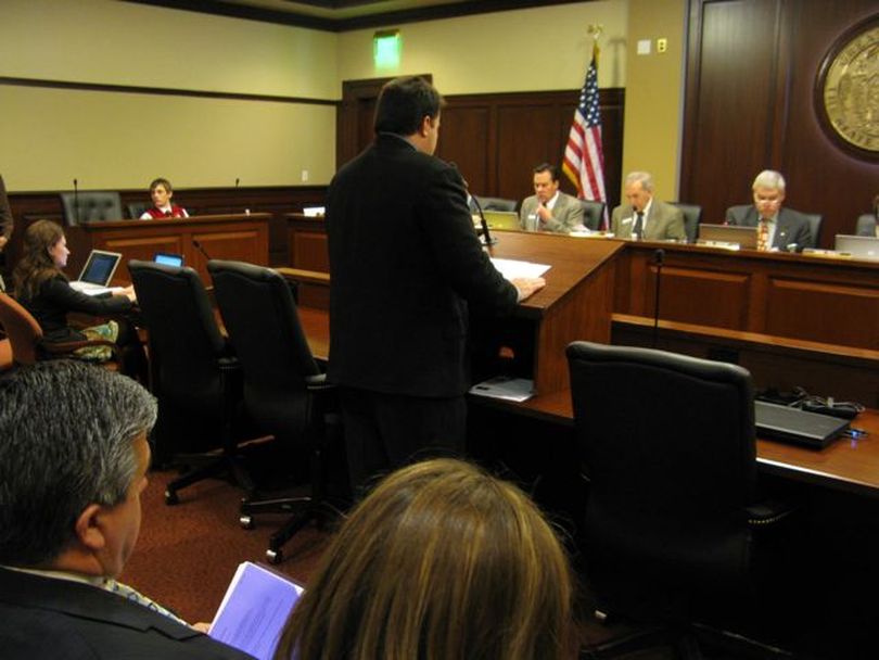 Jason Hancock, aide to state schools Supt. Tom Luna, presents the first bill on Thursday to implement Luna's far-reaching education reform plan. At left is Luna, watching from the front row of the audience at the Senate Education Committee meeting. Hearings on the bills are scheduled for next week. (Betsy Russell)