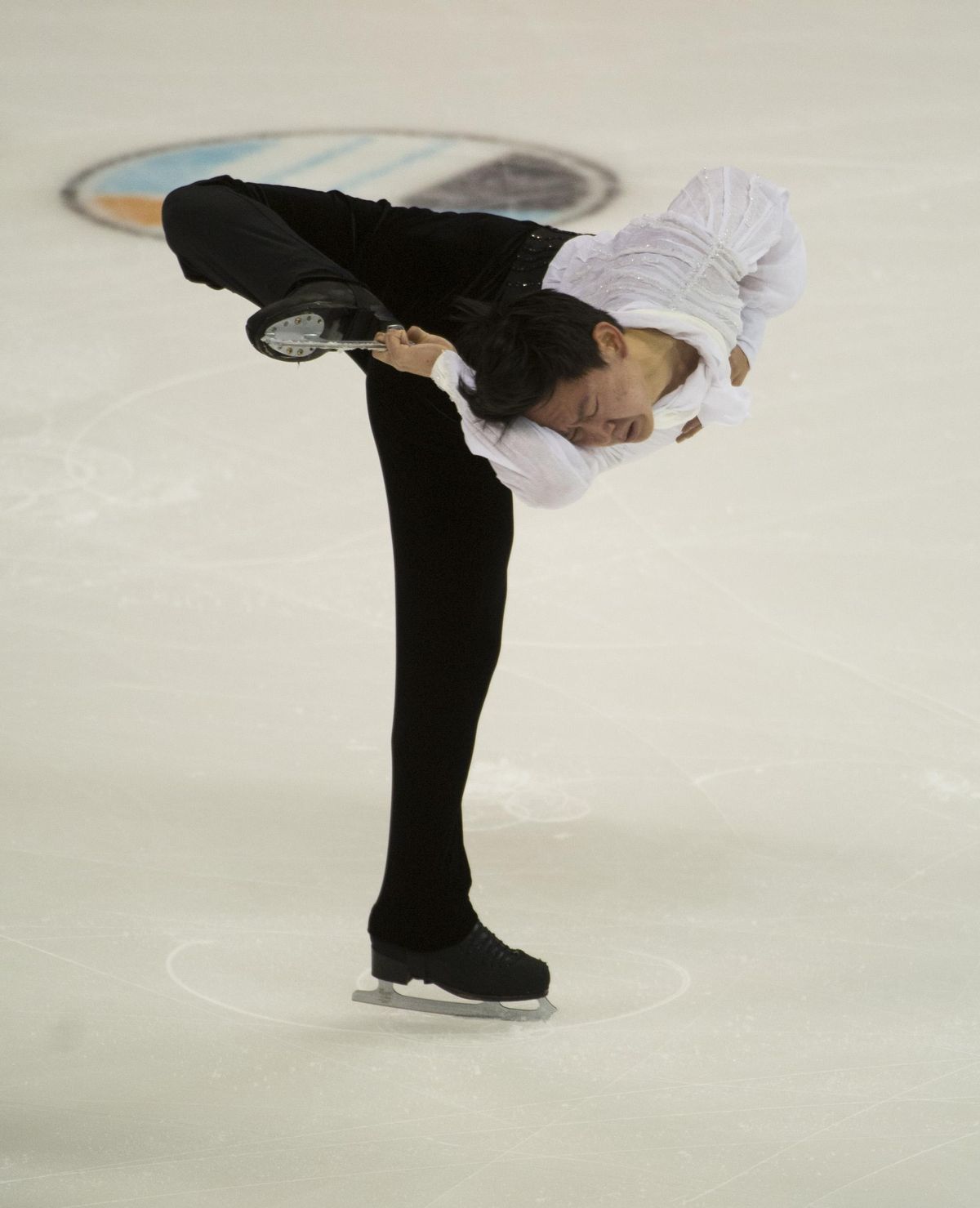 Team Asia Denis Ten from Kazakhstan performs a spin during the 2016 Team Challenge Cup