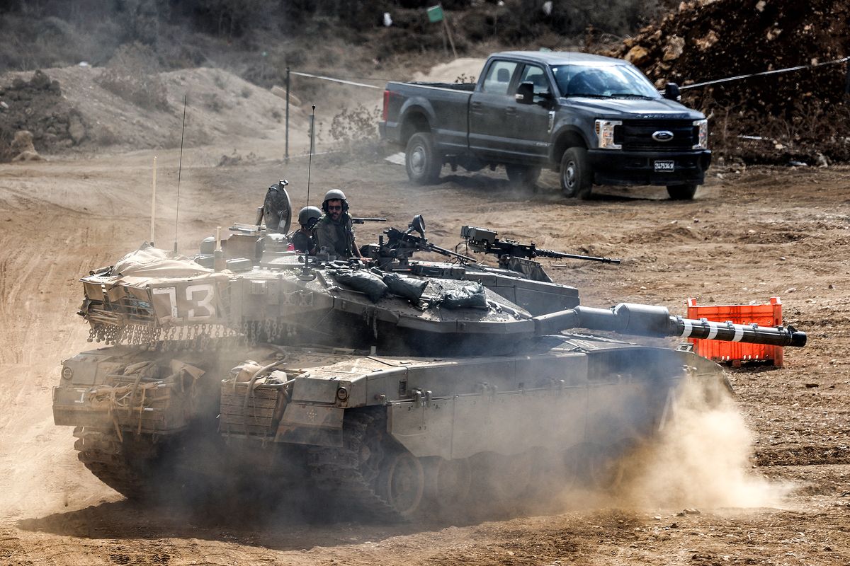 An Israeli army main battle tank moves at a position along the border with Lebanon in northern Israel on Oct. 1, 2024. The Israeli army on October 1 said it launched a ground offensive in Lebanon and that its forces engaged in clashes, further escalating the conflict after a week of intense air strikes that killed hundreds. The UN peacekeeping mission in Lebanon said, however, the Israeli operation did not amount to a "ground incursion" and while Hezbollah denied any troops had crossed the border, an Israeli security official said localised raids had taken place and they were limited in scope.  (Ahmad Gharabli/AFP/GETTY IMAGES NORTH AMERICA/TNS)