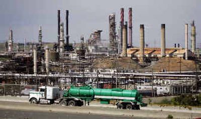 
A tanker truck passes in front of Chevron Refinery in Richmond, Calif. 
 (Associated Press / The Spokesman-Review)