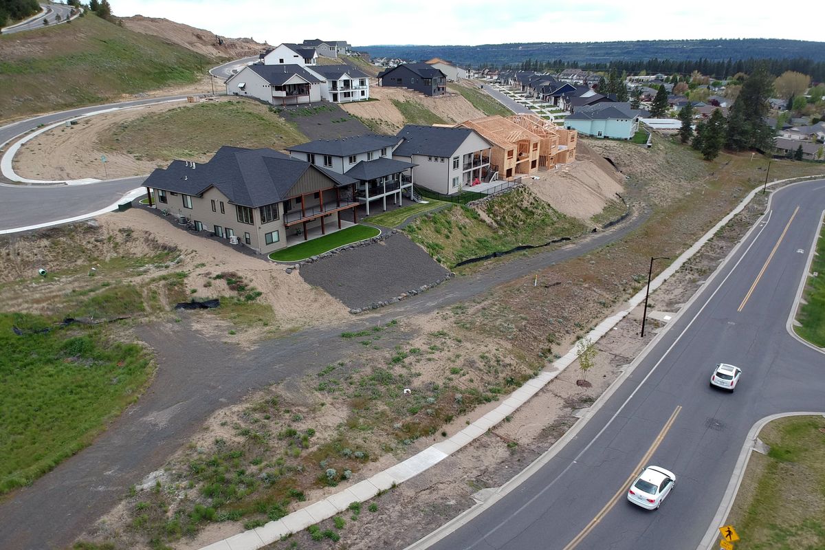 New homes are shown under construction in a new neighborhood off North Indian Trail Road on May 19, 2022.  (Jesse Tinsley/The Spokesman-Review)