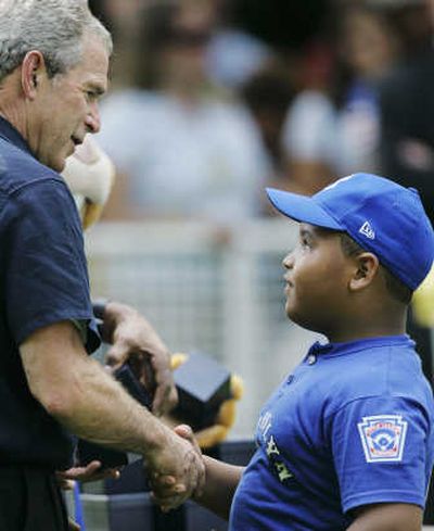 President Bush greets little leaguer Jose Jimenez, of the Inner City Little League Highlanders of Brooklyn, N.Y., following Sunday's T-Ball on the South Lawn baseball game.Associated Press
 (Associated Press / The Spokesman-Review)