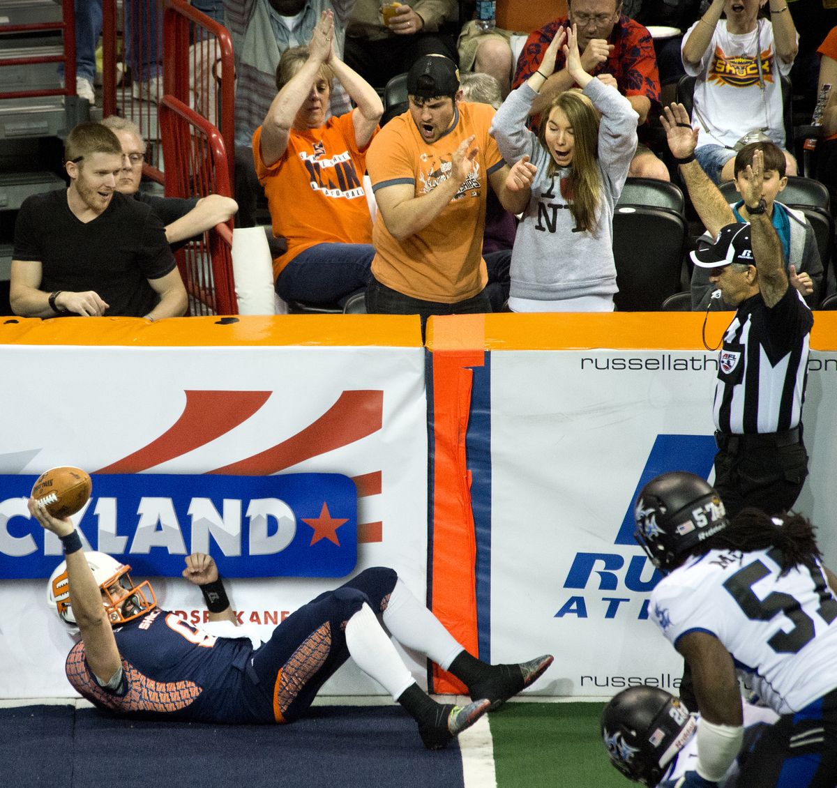 Spokane Shock fans react after quarterback Erik Meyer rushes for a first-quarter touchdown Friday night at the Arena. (Dan Pelle)