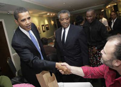 
Presidential hopeful Barack Obama, left, and the Rev. Al Sharpton make the rounds before a fundraiser in  Harlem  on Nov. 29. Associated Press
 (File Associated Press / The Spokesman-Review)