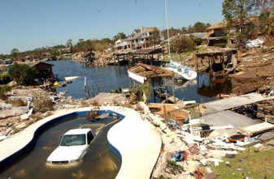 
Damage to the Grande Lagoon subdivision off Gulf Beach Highway in Pensacola, Fla., is seen Friday, one day after Hurricane Ivan tore through the area. Areas around the neighborhood are still closed while officials search for survivors. 
 (Associated Press / The Spokesman-Review)