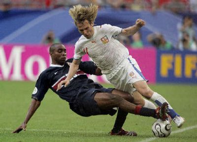 
 Czech Republic's Pavel Nedved, right, is tackled by United States' Eddie Pope during the first half. 
 (Associated Press / The Spokesman-Review)