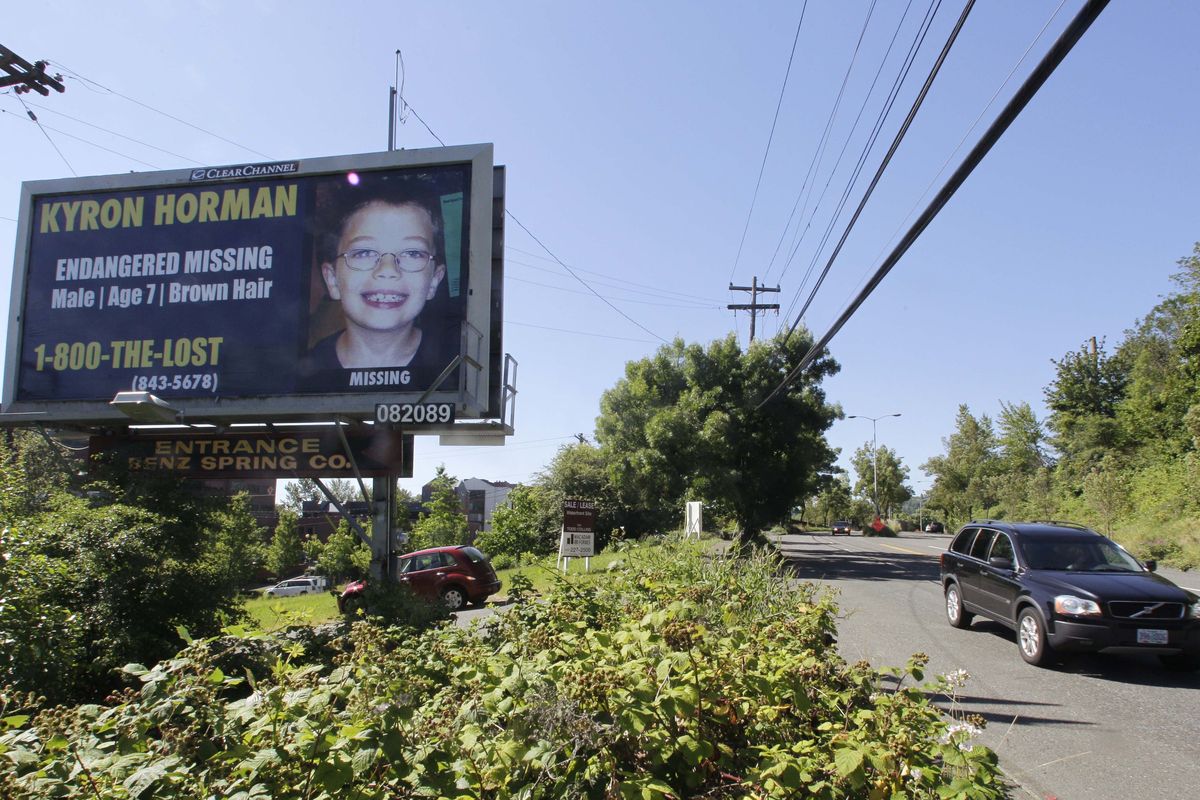 A driver passes a billboard of Kyron Horman, who has been missing since June 4,  along a road in Portland on Tuesday.  (Associated Press)