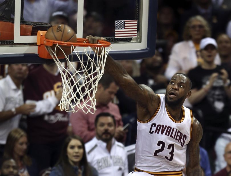 Cleveland Cavaliers forward LeBron James dunks against the Golden State Warriors during the second half of Game 3. (Ron Schwane / Associated Press)