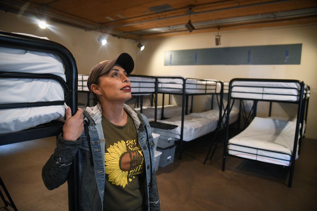 Julie Garcia, of Jewels Helping Hands, shows the city’s new warming center on Cannon Street on Nov. 20, 2019. The center expanded to 80 beds this week after safety improvements were made to increase capacity. (Dan Pelle / The Spokesman-Review)