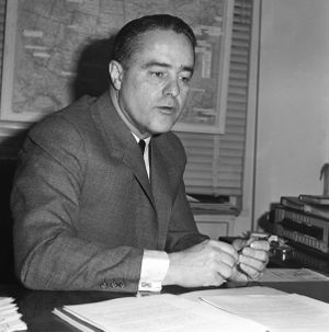This December 1963 file photo shows Peace Corps Director Sargent Shriver in his Washington office. His daughter, Maria Shriver, is launching a new U.S. volunteer initiative called the Shriver Corps. (Associated Press)