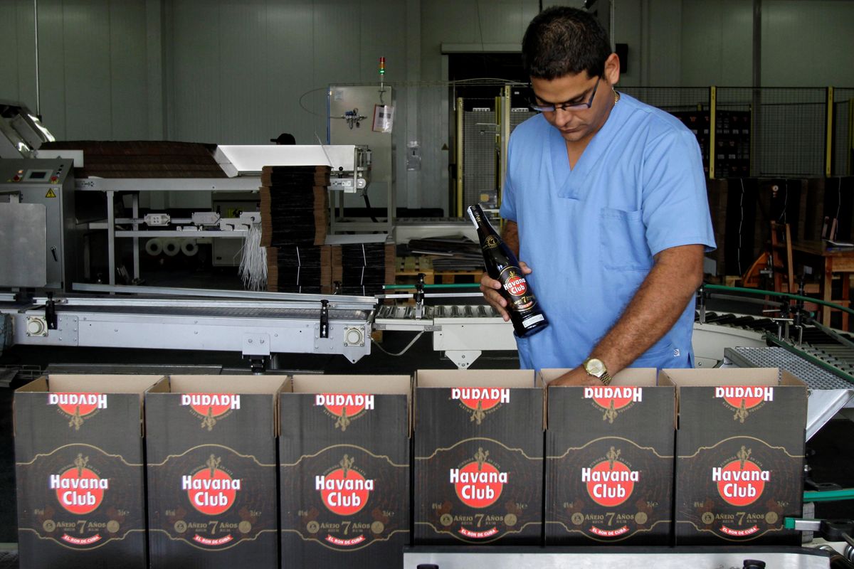 A worker checks production of Havana Club rum at a factory in Havana in 2010. (Associated Press)