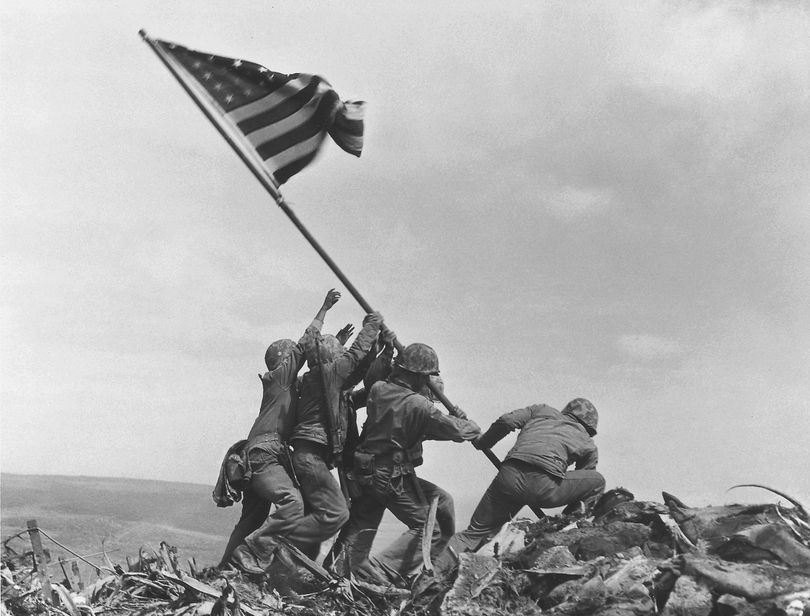 U.S. Marines of the 28th Regiment, 5th Division, raise the American flag atop Mt. Suribachi, Iwo Jima, on Feb. 23, 1945. (Associated Press)