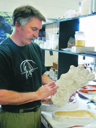 
Jeffrey Meldrum displays what he describes as a casting of a footprint from a Bigfoot creature, taken in the Blue Mountains of Eastern Washington, in his laboratory at Idaho State University in Pocatello in this  2006 file photo. In his book, 