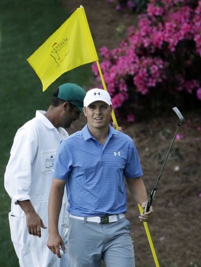 Jordan Spieth acknowledges applause after a birdie on the 13th green during third round. (Associated Press)