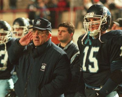 Former Gonzaga Prep football coach Don Anderson, left, listens to an official’s call during a game against Richland. (Colin Mulvany / The Spokesman-Review)