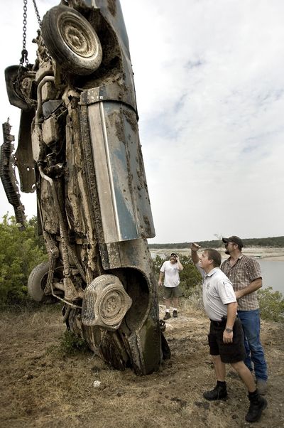 A  car is pulled out of Lake Travis  near Spicewood, Texas, on Thursday. Lower water levels have revealed three vehicles.  (Associated Press / The Spokesman-Review)