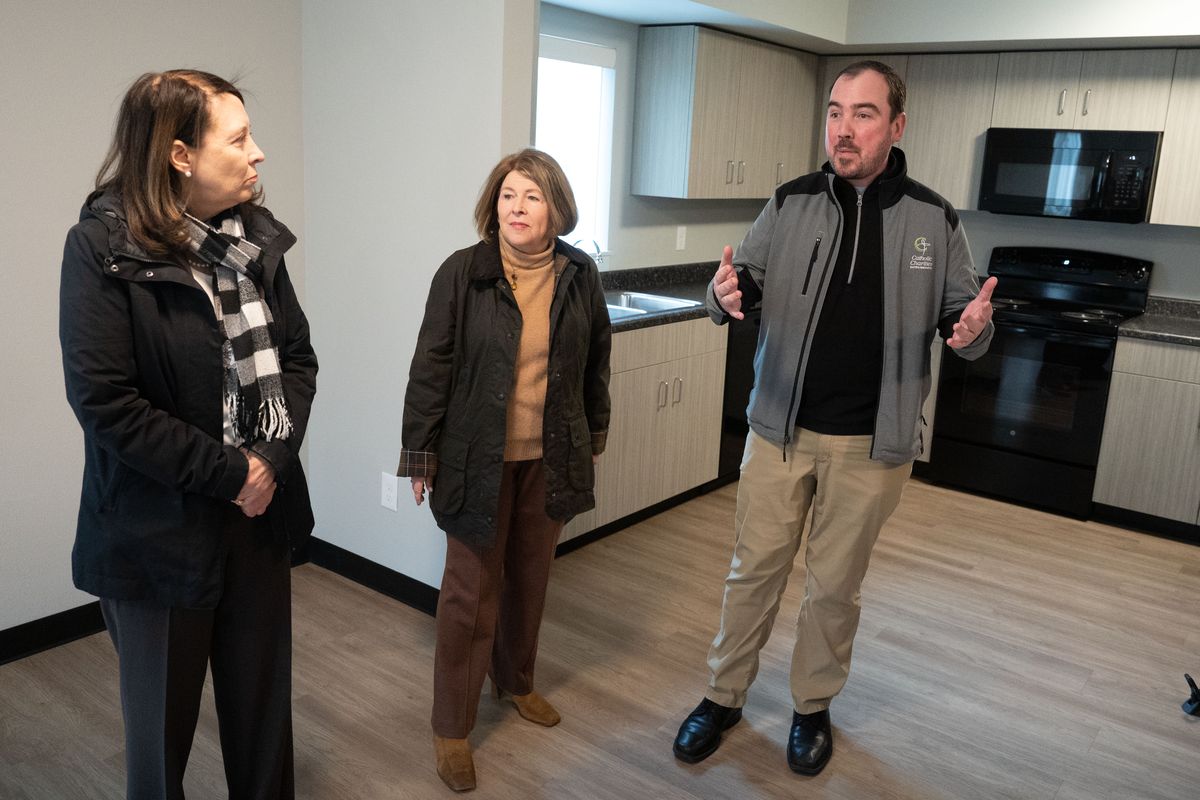 After a media conference, Jonathan Mallahan, chief housing officer for Catholic Charities, gives a tour of low-income housing at the Mother Teresa Haven apartments to Sen. Maria Cantwell, left, and Spokane Mayor Lisa Brown on Feb. 19. Cantwell fought to include legislation in the recently passed bipartisan tax package that expanded the Low-Income Housing Tax Credit.  (COLIN MULVANY/THE SPOKESMAN-REVIEW)