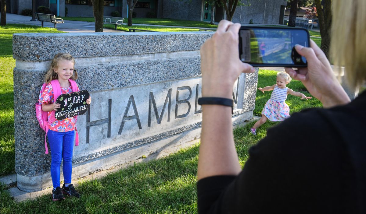 Audrey Adams, 5, has picture taken by her mother, Tana, on the first day of kindergarten at Hamblen Elementary School, Sept. 4, 2019. During the 2014-15 school year, 61.5% of Hamblen students met the standard for language arts. Last year the percentage soared to 74%. The improvement in math is even more striking: from 51.3% to 68.1%. (Dan Pelle / The Spokesman-Review)