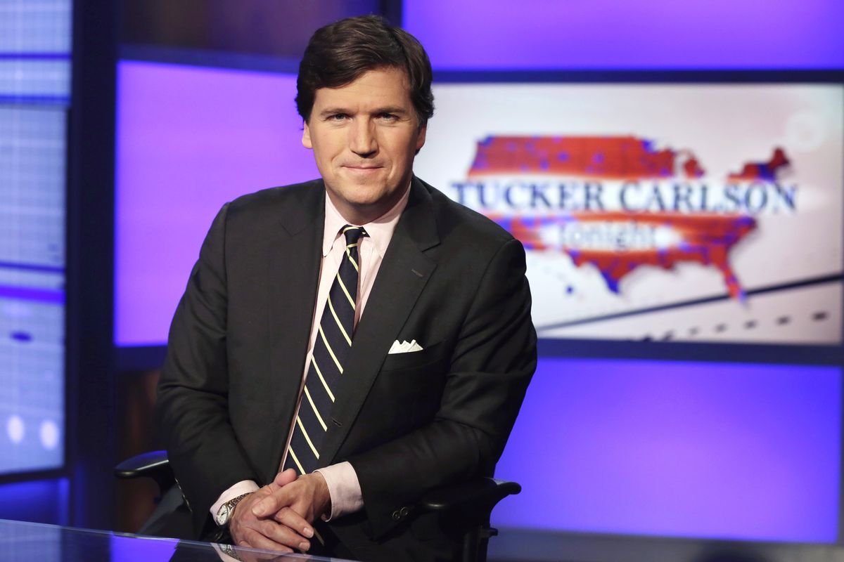 Tucker Carlson, host of “Tucker Carlson Tonight,” poses in a Fox News Channel studio in 2017, in New York.  (Richard Drew)