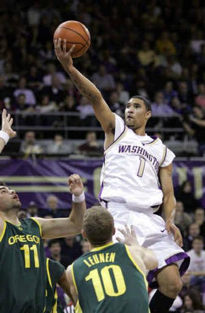 
After struggling academically in high school, Tre Simmons has risen to the occasion since arriving at Washington last year. 
 (Associated Press / The Spokesman-Review)