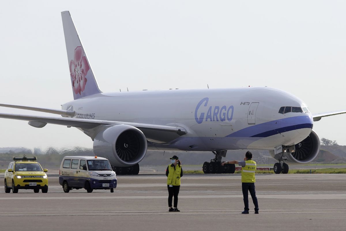 In this photo released by the Taiwan Centers for Disease Control, a China Airlines cargo plane carrying COVID-19 vaccines from Memphis arrive at the airport outside Taipei, Taiwan, Sunday, June 20, 2021. The U.S. sent 2.5 million doses of the Moderna COVID-19 vaccine to Taiwan on Sunday, tripling an earlier pledge in a donation with both public health and geopolitical meaning. (HOGP)