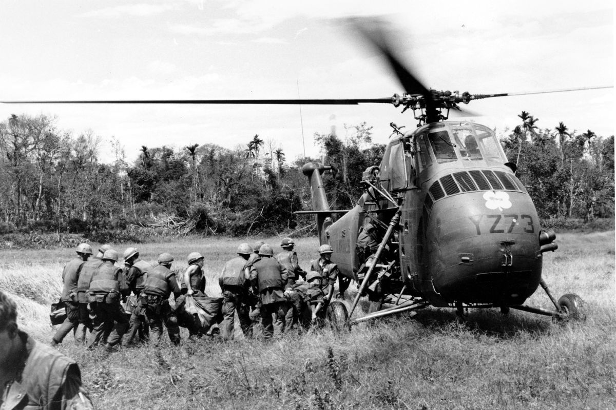 U.S. Marines and Navy Corpsmen line up to load casualties aboard a H-34 Marine helicopter at Con Thien, just below the demilitarized zone, in Vietnam on May 17, 1967, during the Vietnam War.  (Stringer)