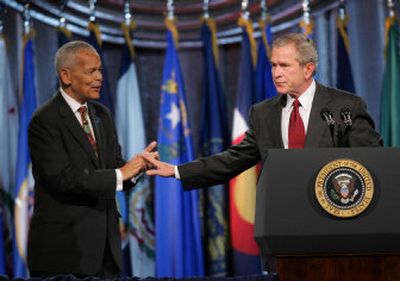 
President Bush gestures to NAACP Chairman Julian Bond, left, during an appearance  Thursday at the NAACP Annual Convention in Washington, D.C. 
 (Associated Press / The Spokesman-Review)
