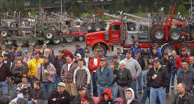 
More than 200 members of the Northwest Log Truckers Co-op gather in the Tacoma Dome parking lot Tuesday. More than 200 members of the Northwest Log Truckers Co-op gather in the Tacoma Dome parking lot Tuesday. 
 (Associated PressAssociated Press / The Spokesman-Review)